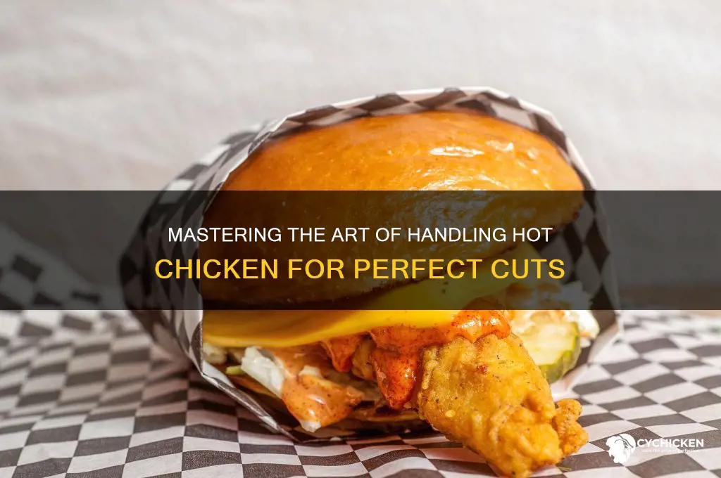 how to hold hot chicken while cutting