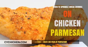 Perfect Timing: Sprinkling Bread Crumbs on Chicken Parmesan for Crispy Perfection
