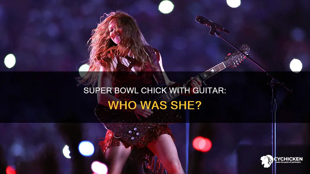 who was the chick with the guitar super bowl
